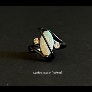 Elliptical White Fire Opal Womens Ring Black IP Setting CZ Flanks Mystical Stone